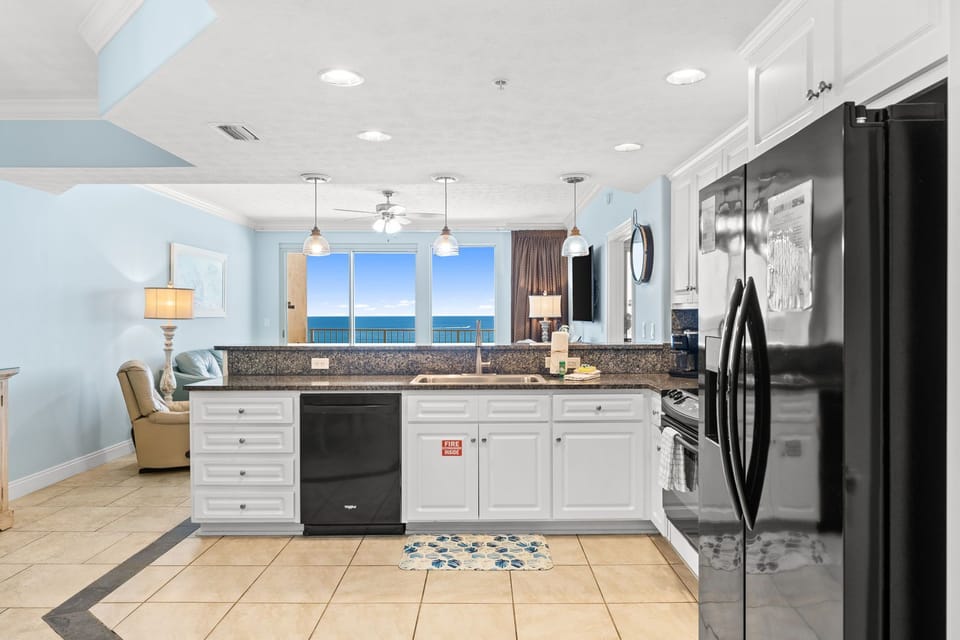The fully equipped kitchen features granite countertops and has everything you need to prepare meals for family & friends.