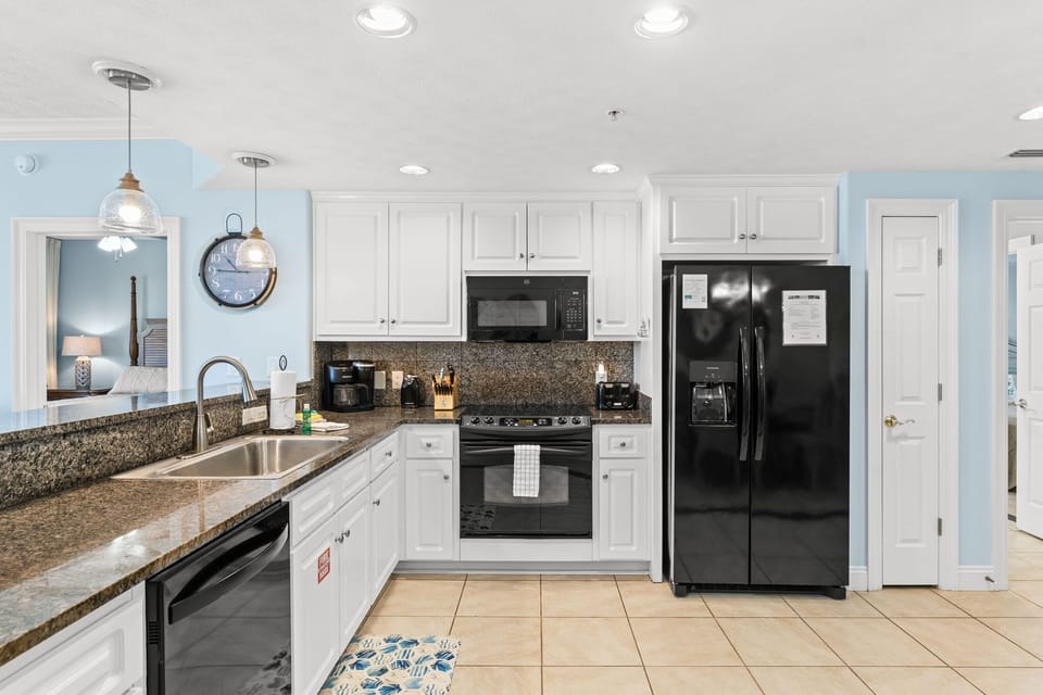 The fully equipped kitchen features granite countertops and has everything you need to prepare meals for family & friends.