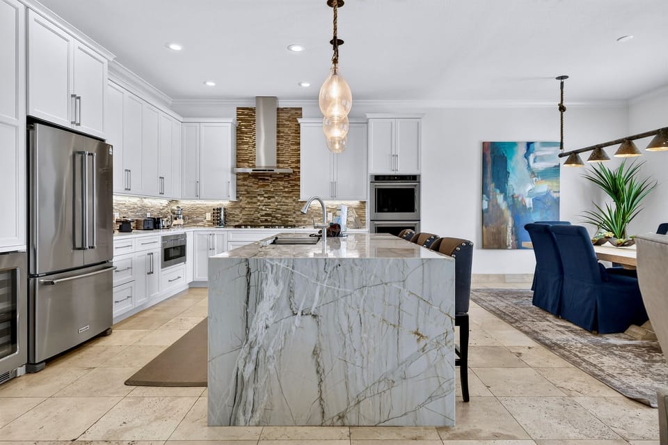 2nd Floor - Gourmet chef’s kitchen at SunnySide with professional-grade appliances, a gas range, and all the cookware you need—perfect for family meals, group dinners, and effortless entertaining during your Destin stay.