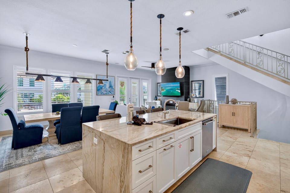 2nd Floor - Gourmet chef’s kitchen at SunnySide with professional-grade appliances, a gas range, and all the cookware you need—perfect for family meals, group dinners, and effortless entertaining during your Destin stay.
