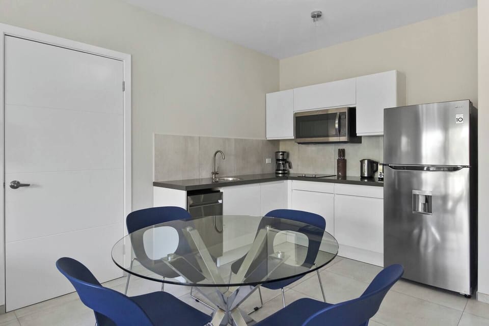 Prepare your favorite meals in the fully equipped kitchen, then gather around the dining table to enjoy them together.