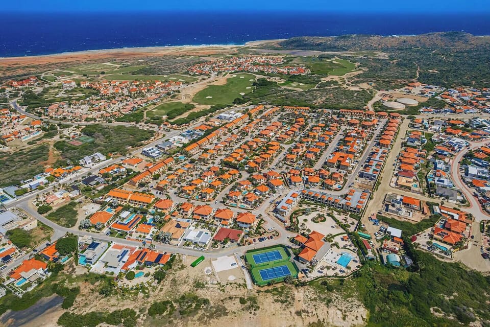 Gold Coast Aruba is a luxurious, gated resort-style community located in the prestigious Malmok area on the northern coast of Aruba offering a mix of condominiums and villas, designed for guests seeking privacy, security, and upscale Caribbean living