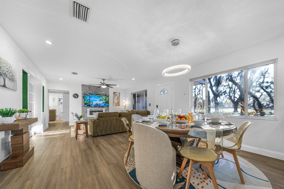 Gather around the spacious dining table and enjoy meals in a setting that feels both upscale and relaxed.