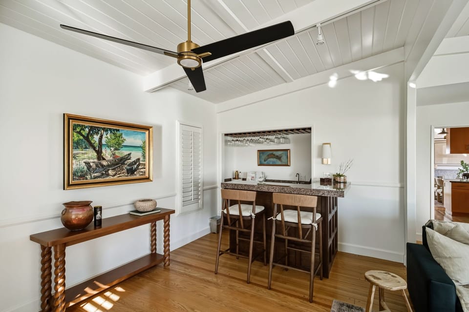 This inviting dining area offers a relaxed space to gather, with natural light and an open flow to the kitchen.