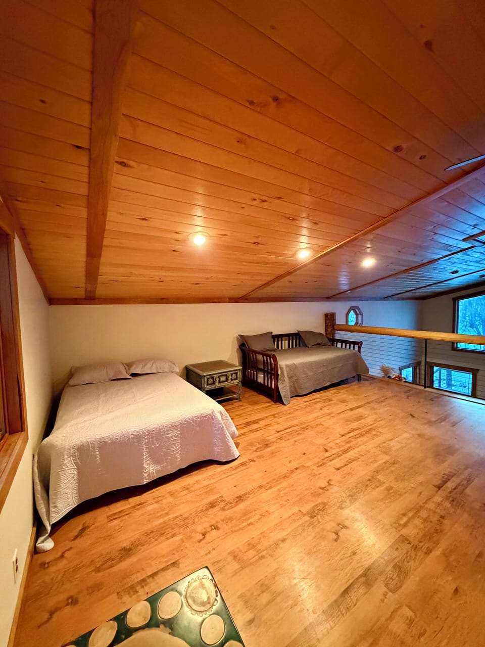 Full bed and twin trundle bed in loft