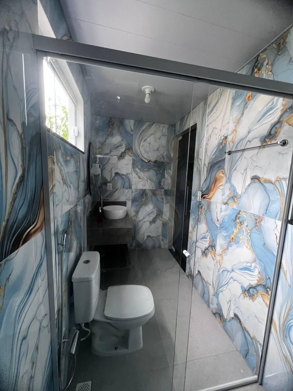 Shower, hair dryer, towels, toilet paper