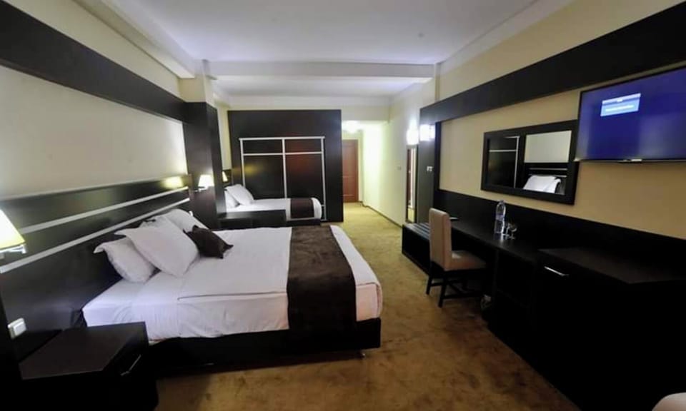 Standard Double or Twin Room | Minibar, desk, laptop workspace, blackout drapes