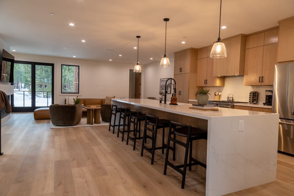 14' double waterfall kitchen island w/ bar seating.