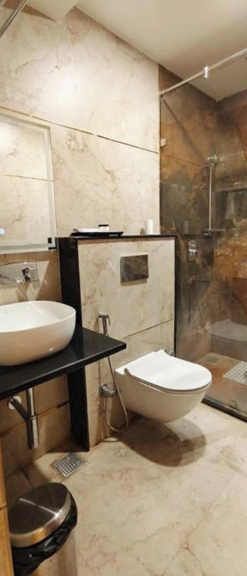 Shower, rainfall showerhead, slippers, towels