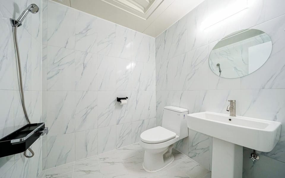 Shower, hair dryer, slippers, towels