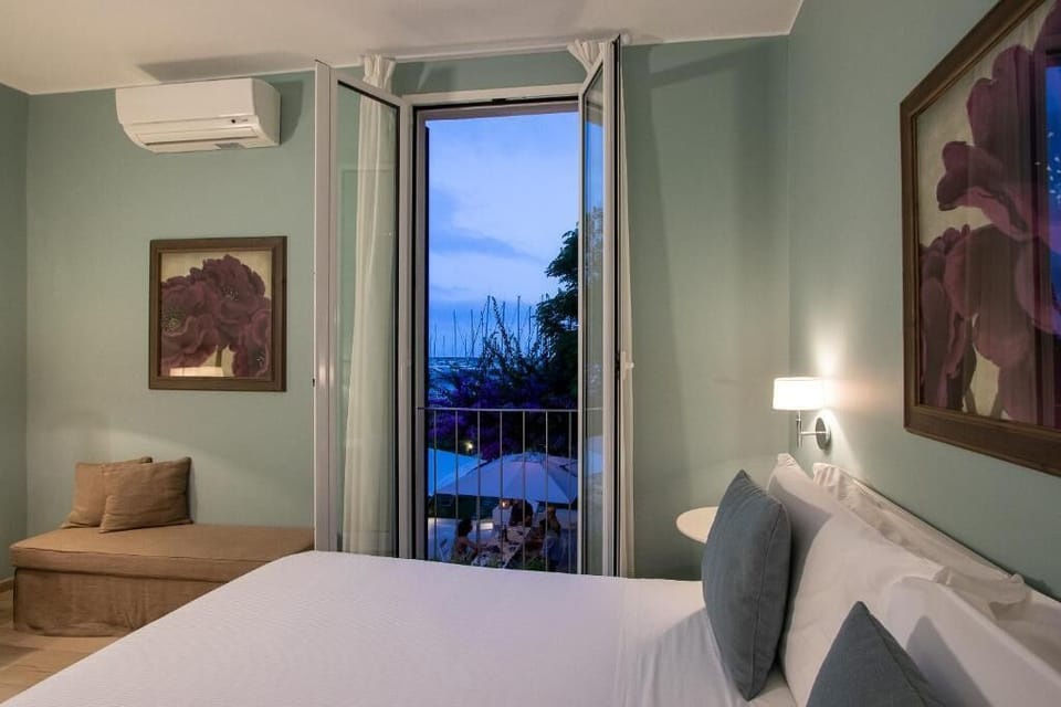Deluxe Double Room, Sea View | Down comforters, in-room safe, desk, laptop workspace
