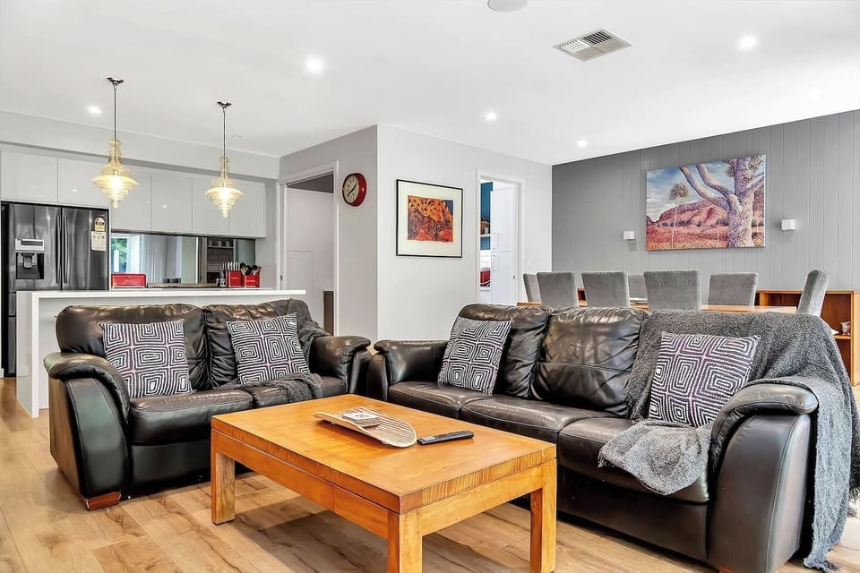 Plush leather seating in a sun-drenched living room.
