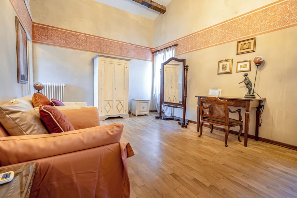 Deluxe Triple Room, City View | Living area | TV