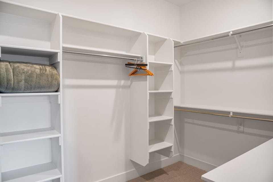 Dual Vanities, Soaking Tub and large glass enclosed shower in the primary ensuite bathroom.  A large walk in closet is attached