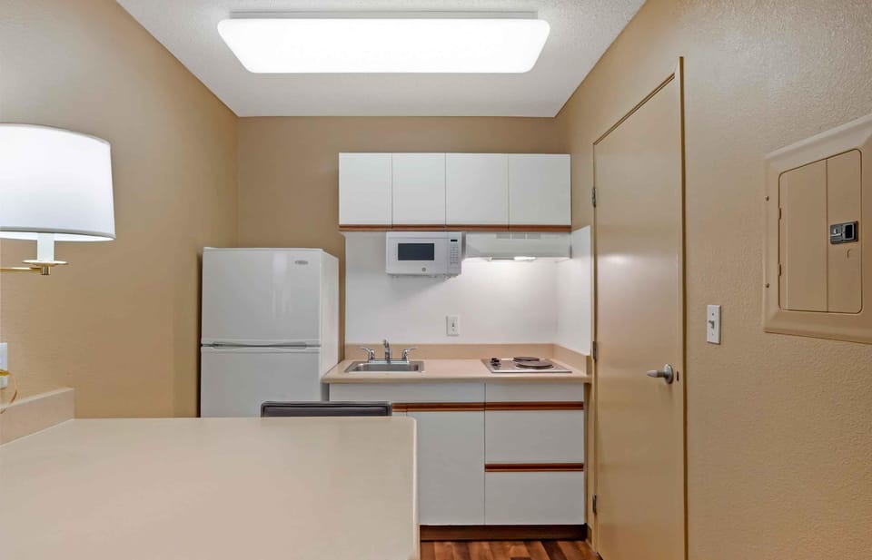 Studio, 1 Queen Bed, Non Smoking | Private kitchen | Fridge, microwave, stovetop, coffee/tea maker