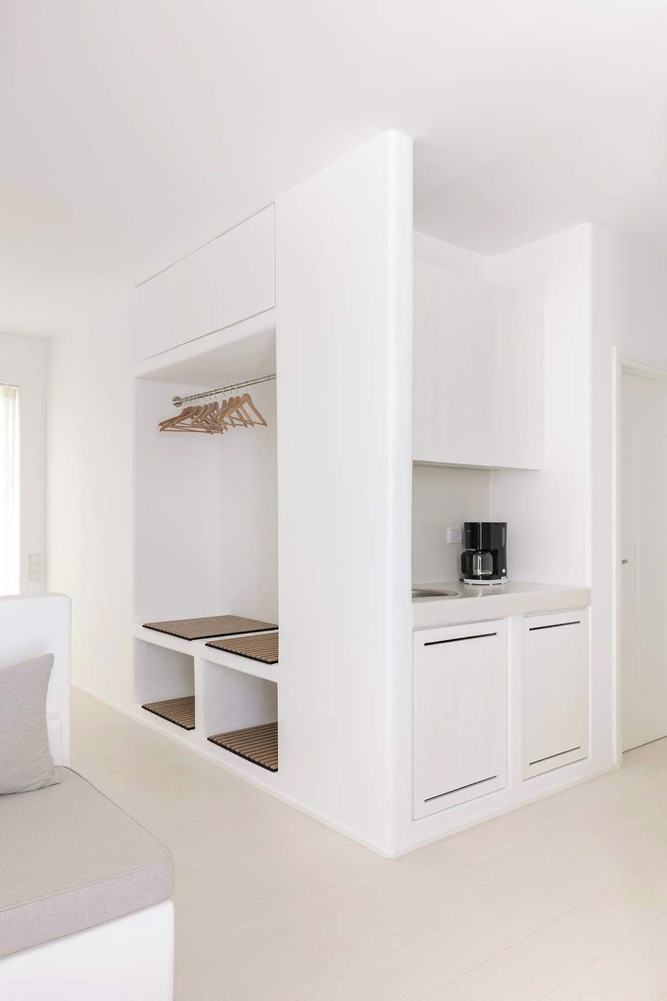 Bedroom area with storage, and a kitchenette