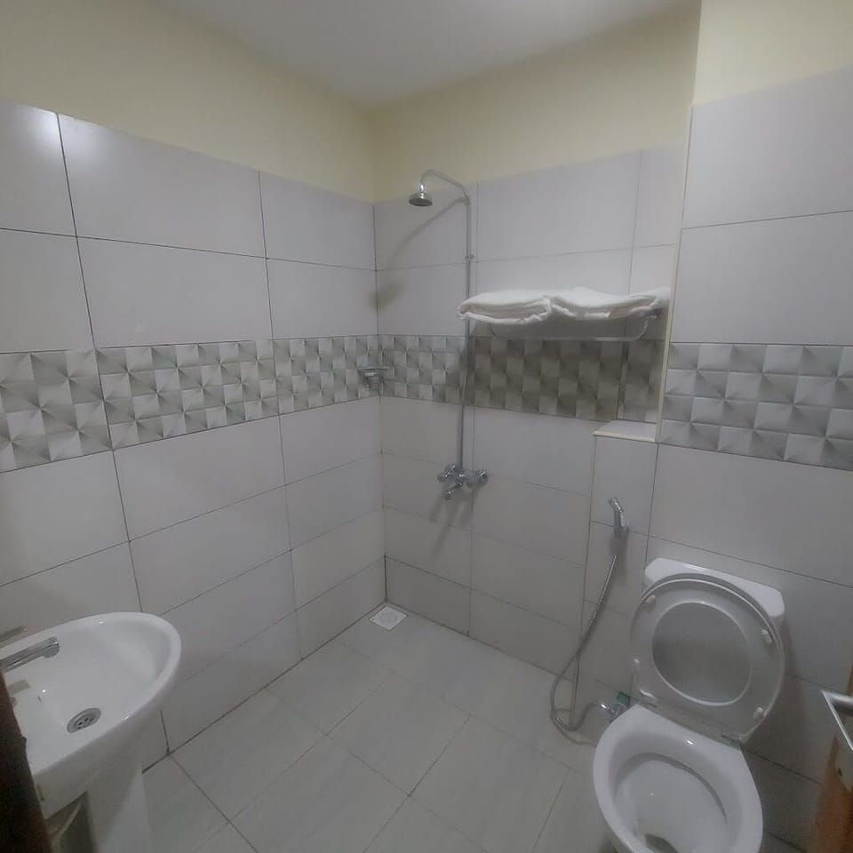 Deluxe Double Room, City View | Bathroom | Shower, slippers, towels, soap