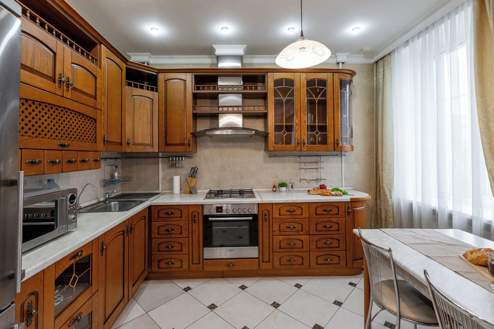 Deluxe Apartment, Non Smoking, Courtyard View | Private kitchen | Electric kettle, cleaning supplies, paper towels, dining table