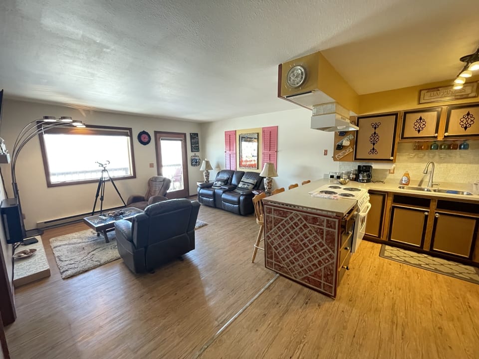 Suite, 2 Bedrooms | Living area | TV, fireplace