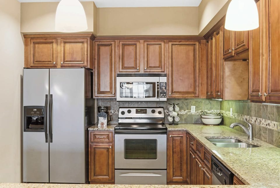 The open kitchen offers ample space & all the comforts of home​