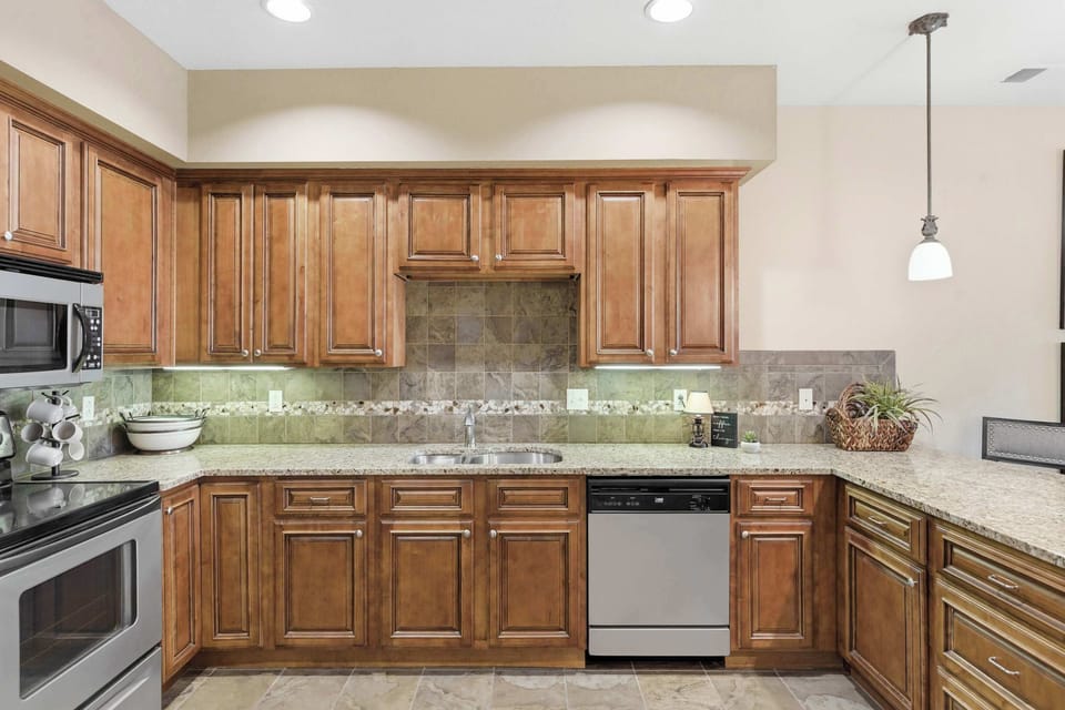 The open kitchen offers ample space & all the comforts of home​