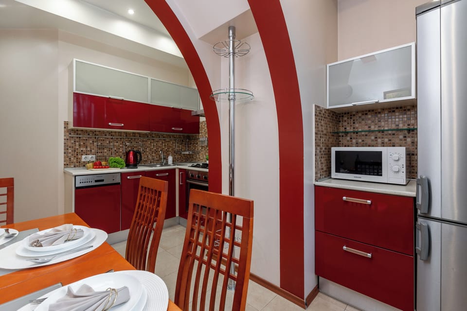 Deluxe Apartment, Non Smoking, Courtyard View | Private kitchen | Electric kettle, cleaning supplies, paper towels