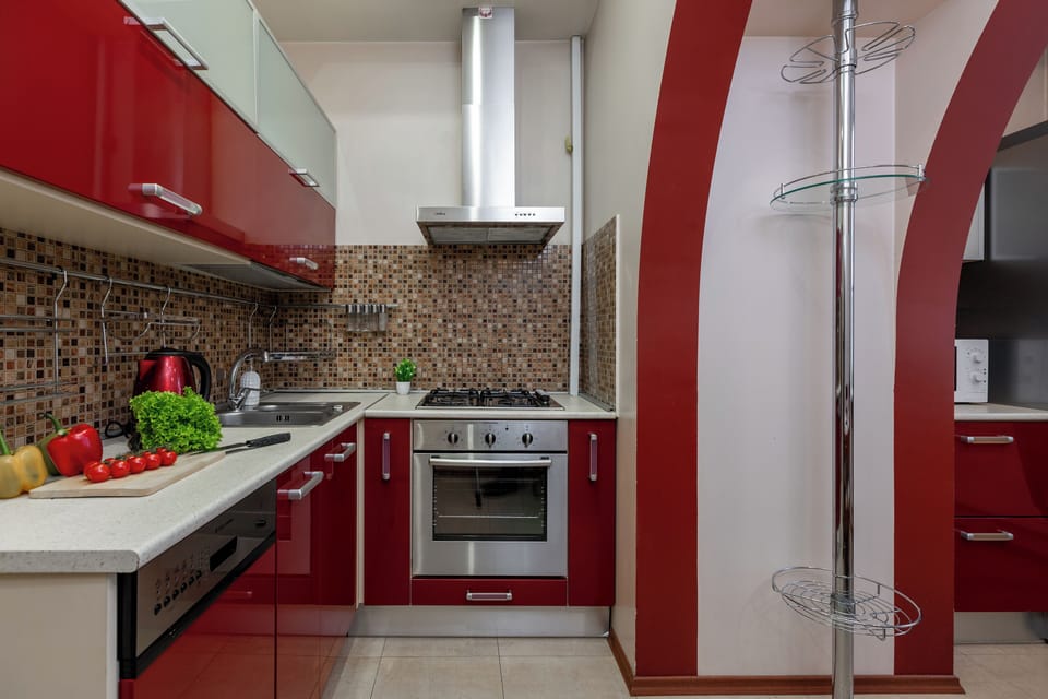 Deluxe Apartment, Non Smoking, Courtyard View | Private kitchen | Electric kettle, cleaning supplies, paper towels