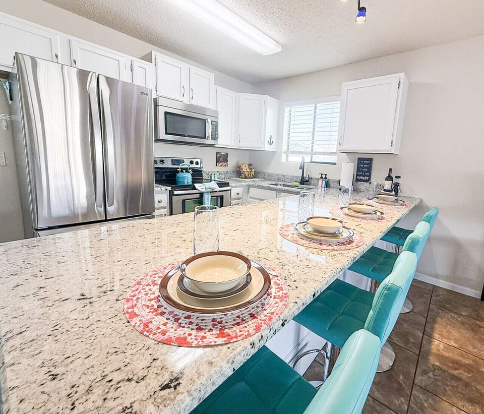 Enjoy meals at the counter or whip up a delcious dinner in the fully equipped kitchen.