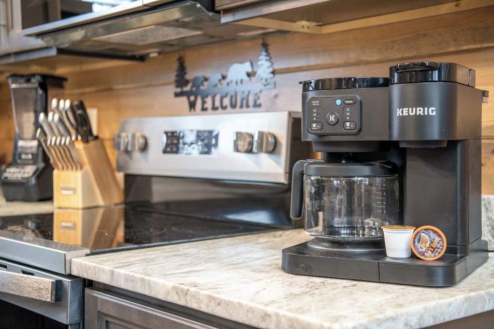 Wake up to fresh coffee brewing in your fully equipped kitchen, complete with modern appliances and everything you need for comfortable mountain mornings.