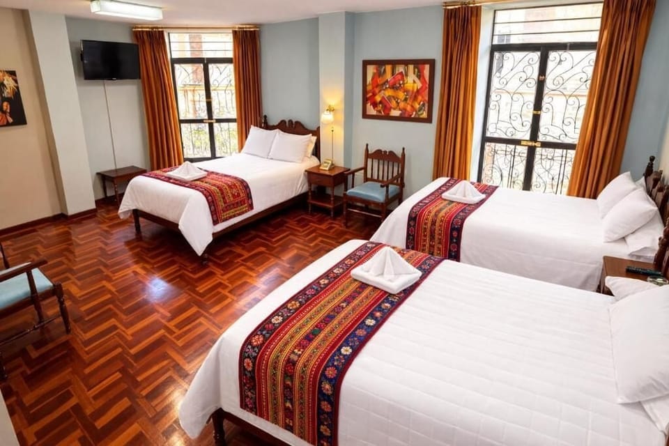 Standard Triple Room | Laptop workspace, bed sheets