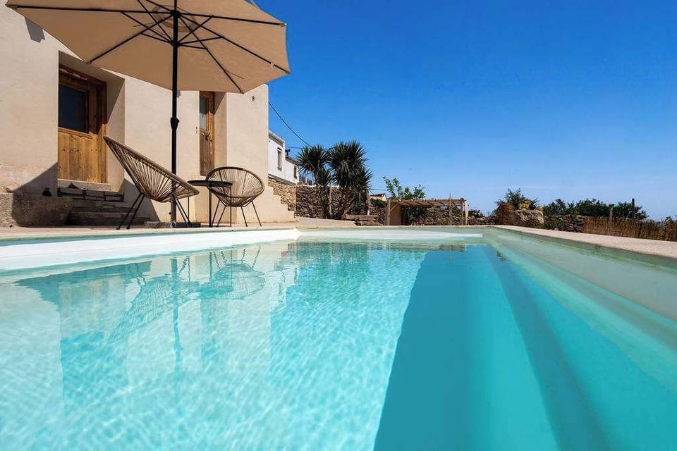 Refreshing Pool with Sun Loungers and Open Views