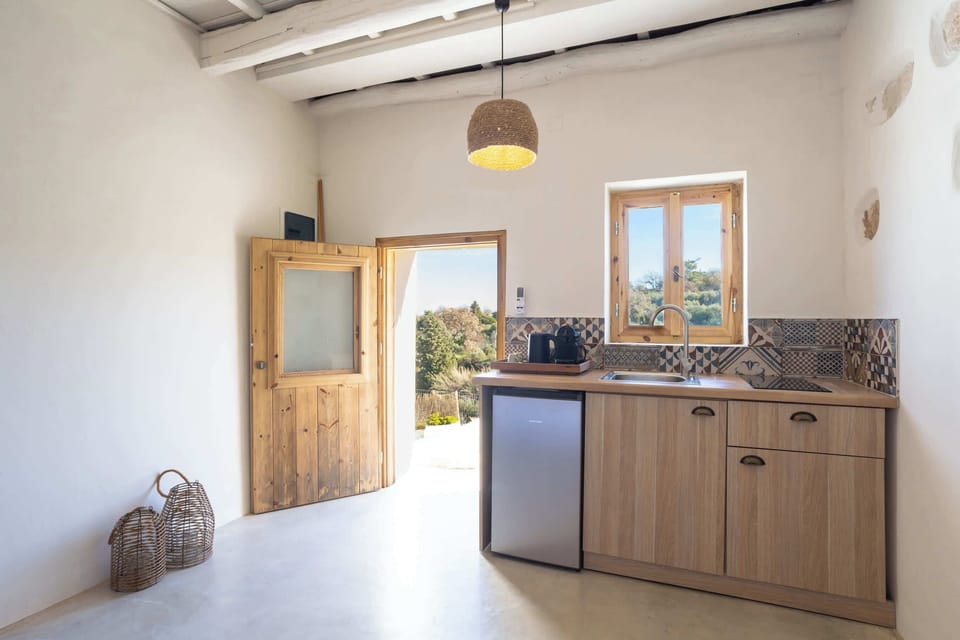 Compact Kitchen Area with Dining Counter and Storage