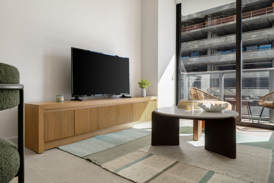 Sleek media wall and cozy lounge seating