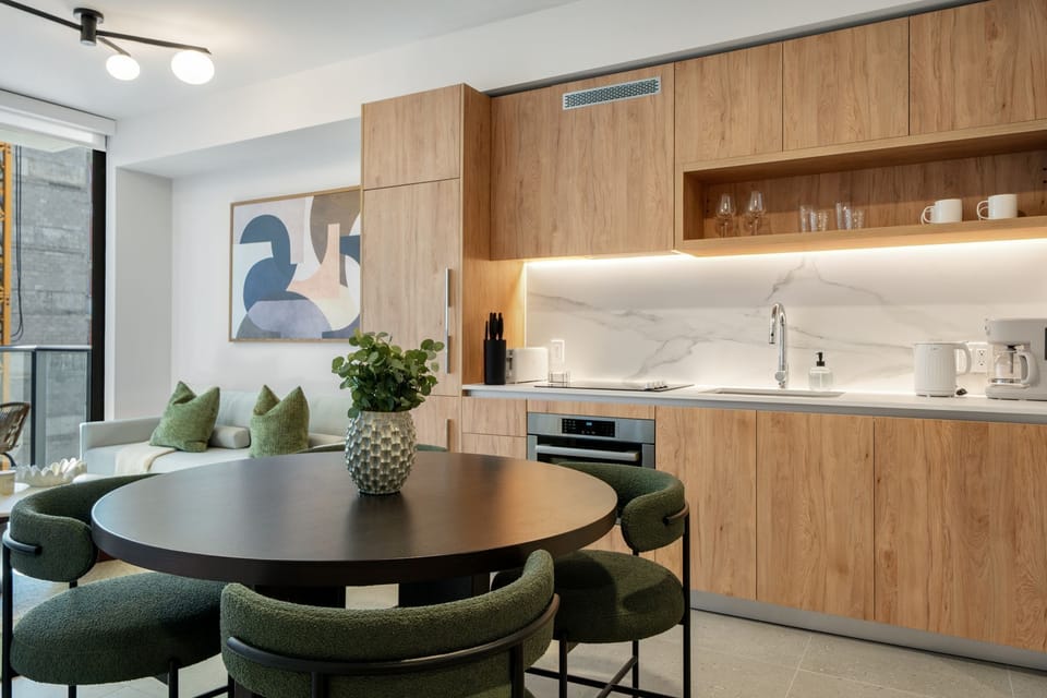 Fully equipped modern kitchen with warm cabinetry