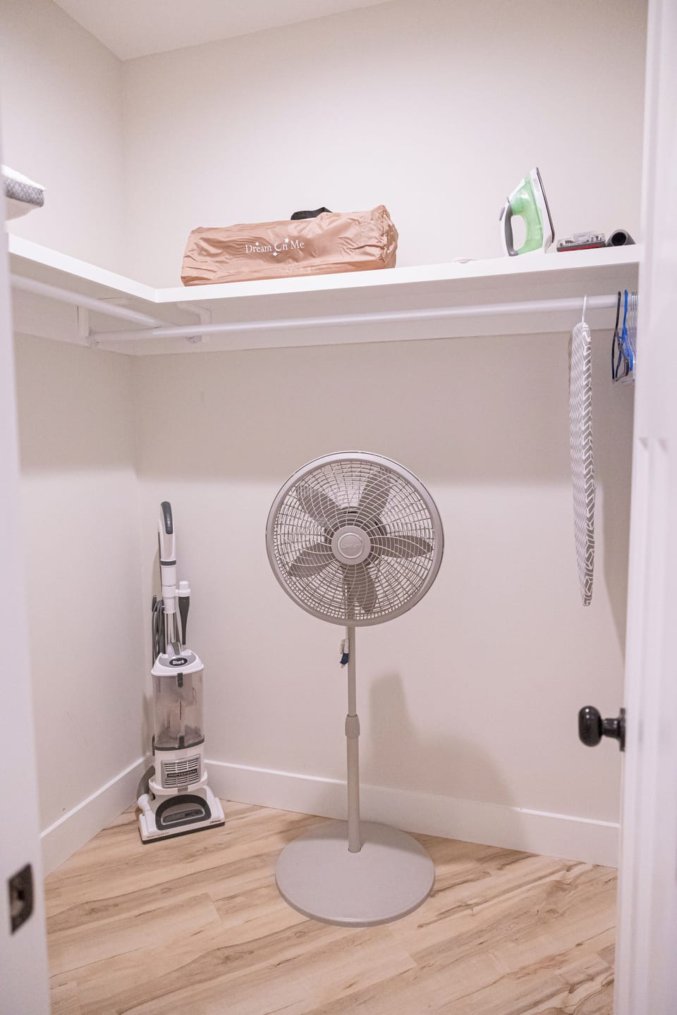 Fan, vacuum, and ironing needs located in primary walk in closet