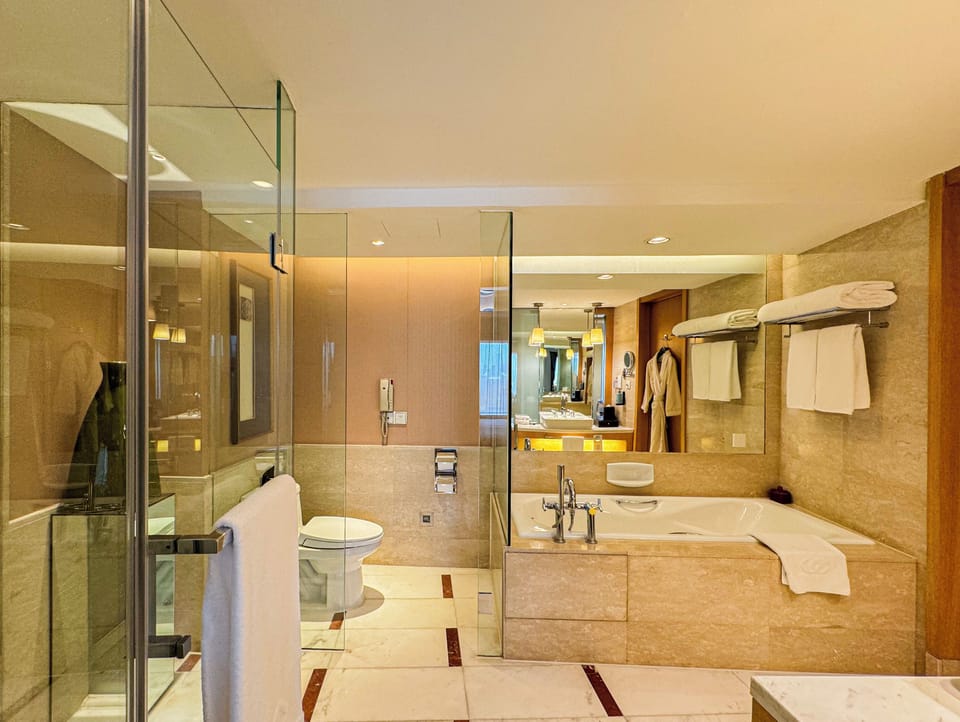 Separate tub and shower, deep soaking tub, designer toiletries