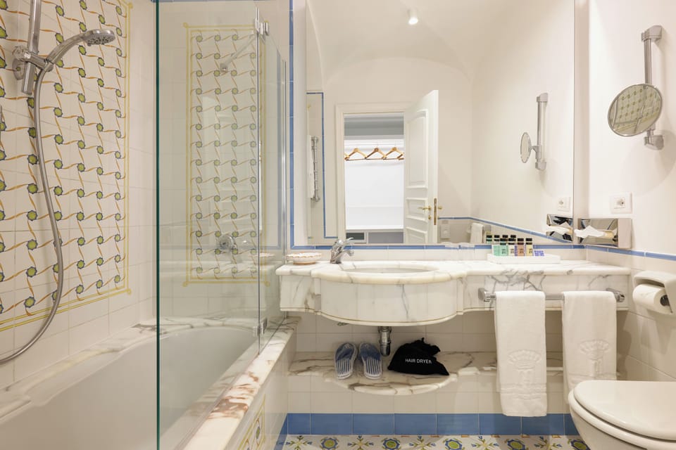Basic Double Room, Patio, Ground Floor | Bathroom | Combined shower/tub, free toiletries, hair dryer, bidet