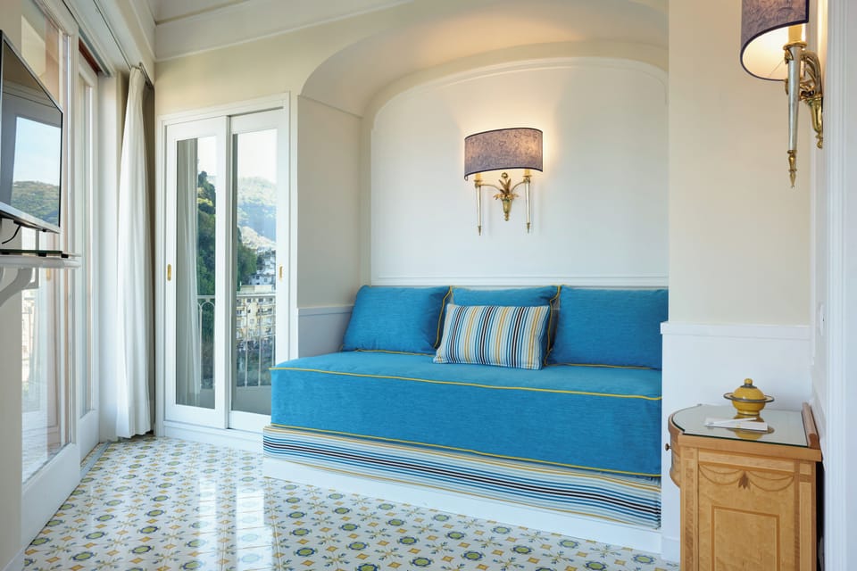 Suite, Partial Sea View | Hypo-allergenic bedding available, minibar, in-room safe, desk