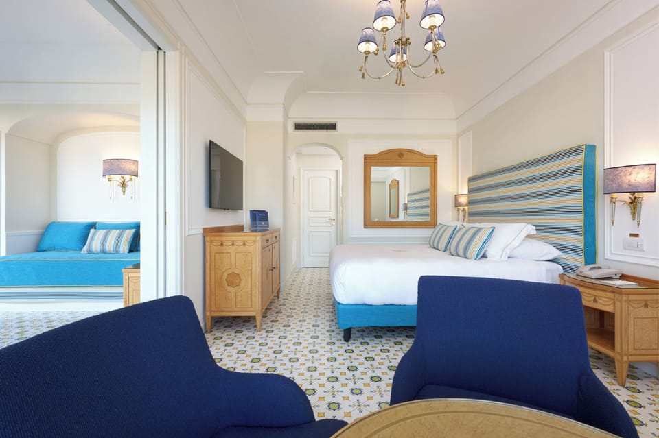 Suite, Partial Sea View | Hypo-allergenic bedding, minibar, in-room safe, desk