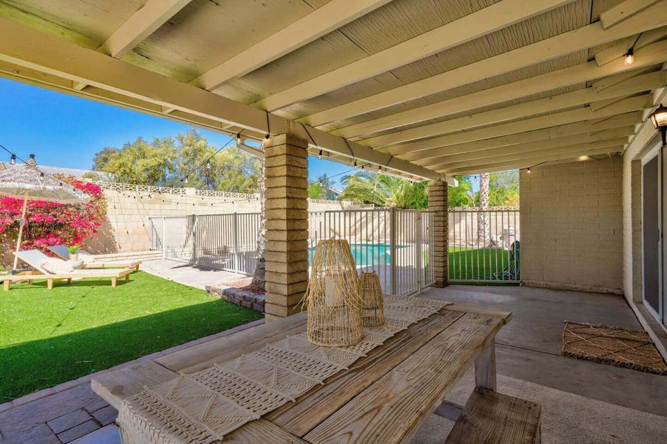 Shaded outdoor sitting area steps from the pool
