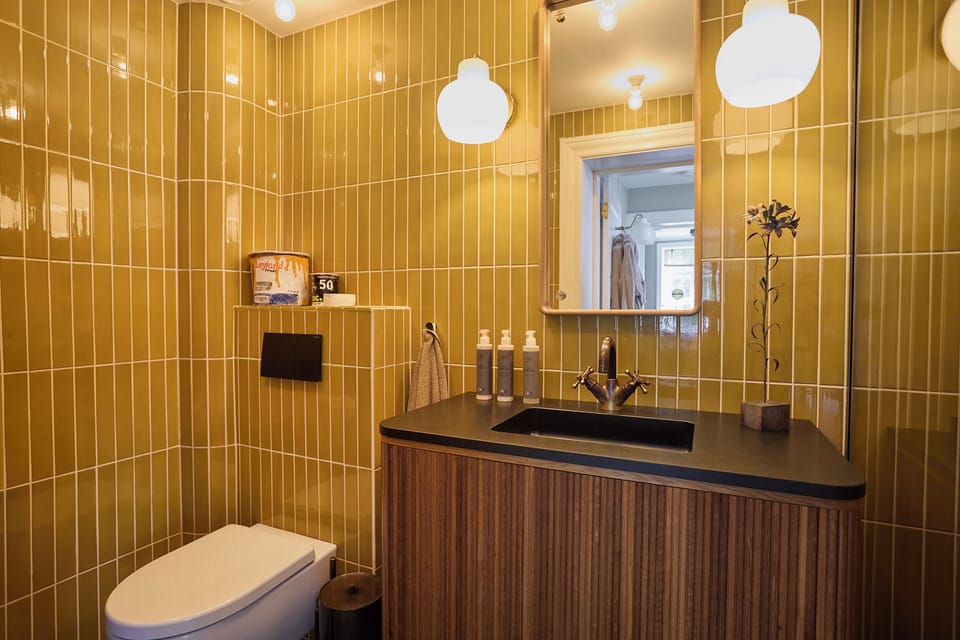 The Grand | Bathroom | Shower, hair dryer, slippers, towels