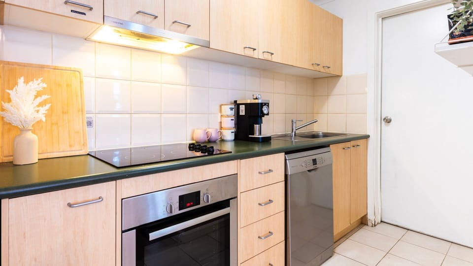 Fully equipped kitchen with modern appliances for easy home cooking