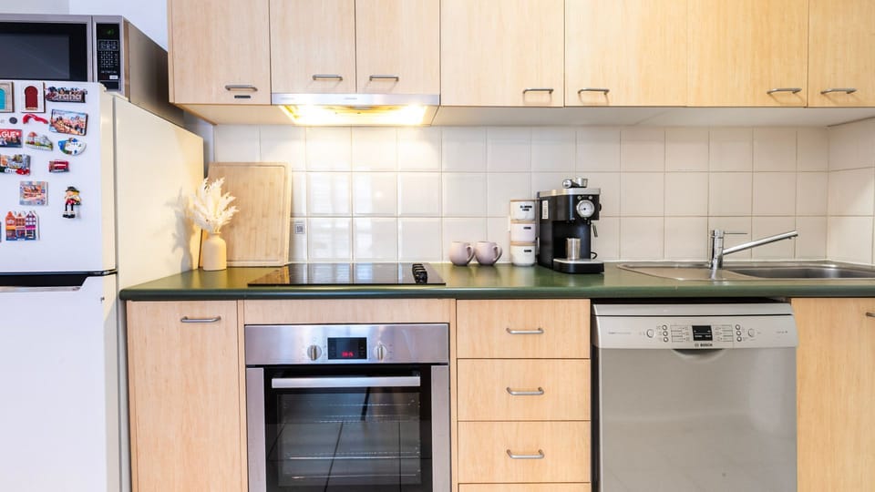 Clean, functional kitchen with ample storage and bench space