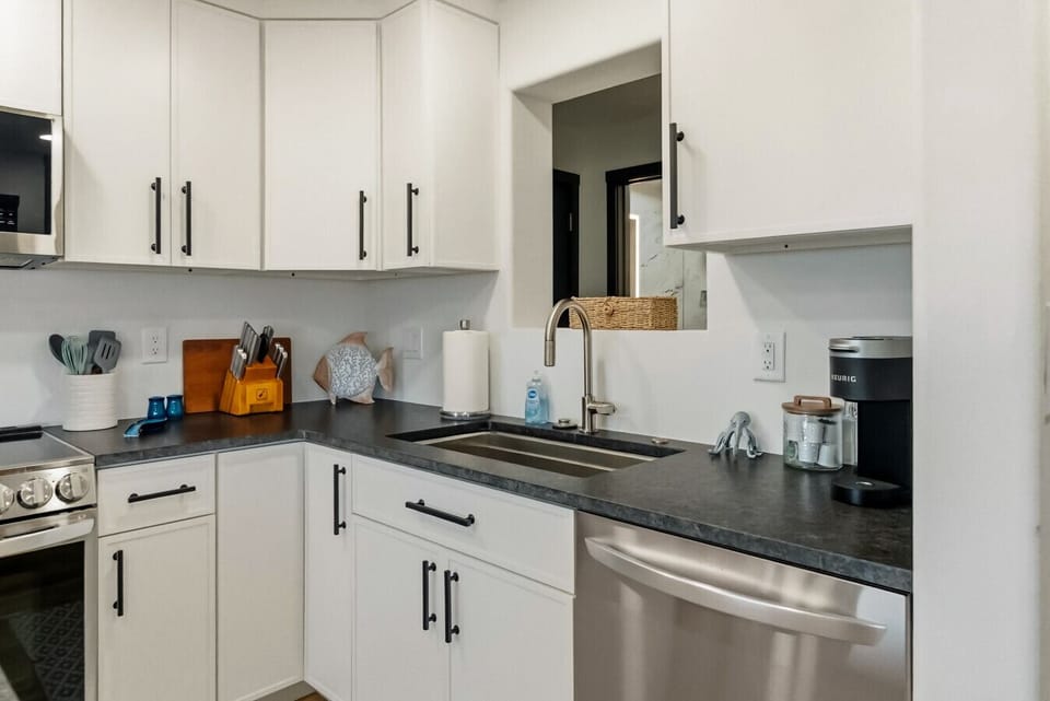Modern kitchen with ample counter space and updated finishes 🍽️