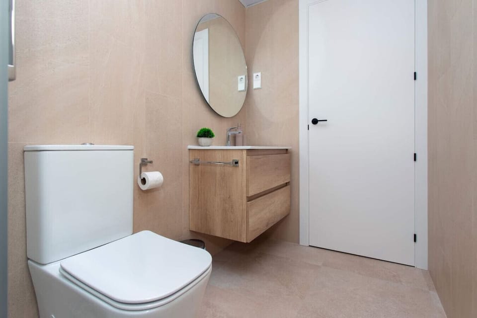 A spa-inspired sanctuary for rejuvenation. This vanity features natural stone textures, a halo-lit mirror, and premium wood finishes. Every detail is curated to provide a serene, high-end grooming experience in total tranquility.
