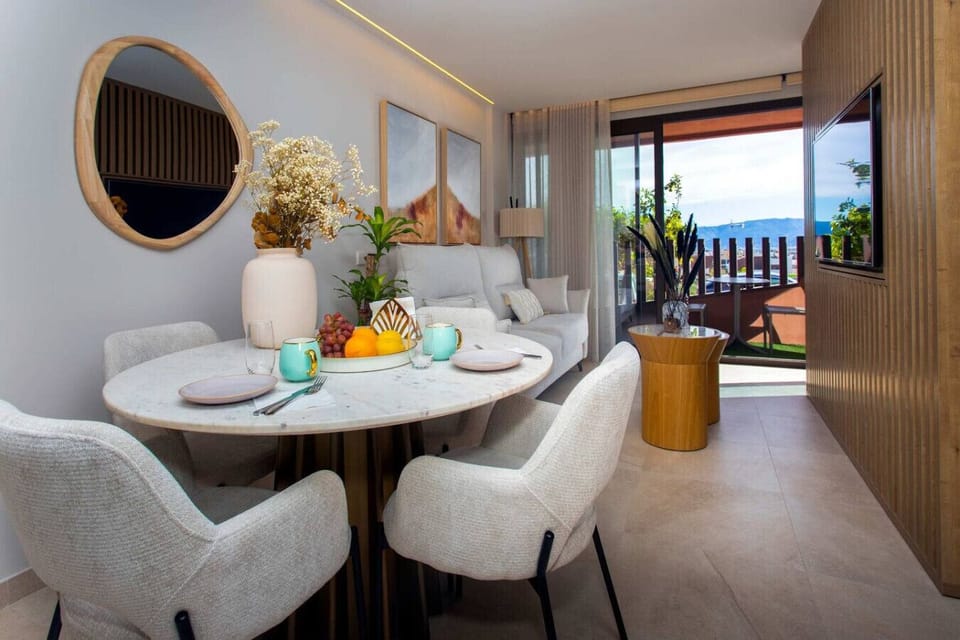 An elegant centerpiece for curated dining This marble-topped ensemble illuminated by sophisticated interior lighting offers a refined space for unhurried connection. Every detail from the organic textures to the bespoke seating defines modern luxury