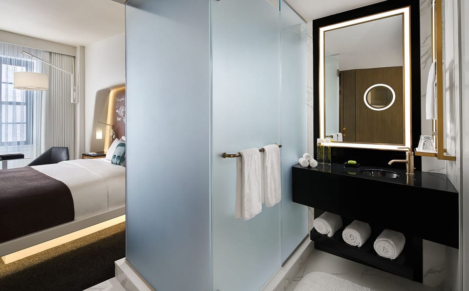 Step into a sleek glass shower and reset instantly.