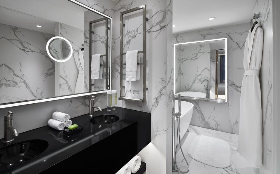 Refresh in a marble-clad bath with spa-level serenity.