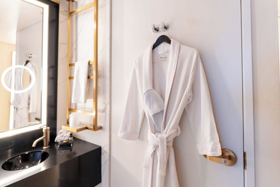 Refresh in a spa-like bath with plush robes and glow mirrors.