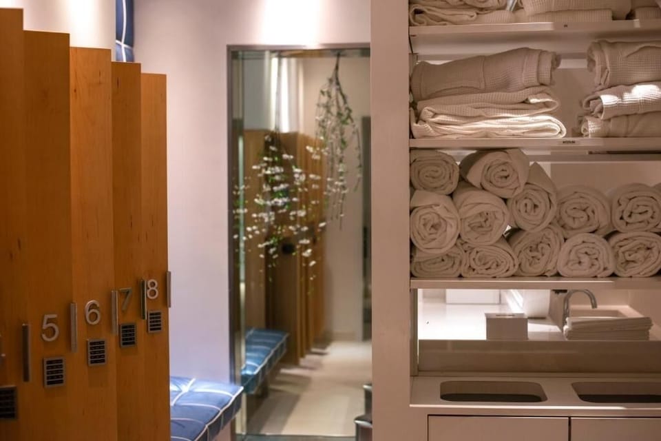 Unwind post-workout with plush towels and serene spa calm.